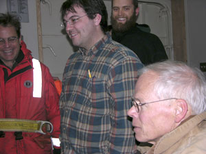 In the ship�s dry lab, where the LAPIS computer system is set up, (from left) Erich, Josh, Byron, and Larry are pleased by the quality of  images of jellies the instrument takes as it is towed. (Photo by Kate Madin, WHOI)