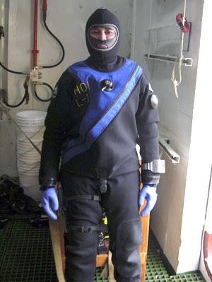 With her full drysuit on, Diane DiMassa is ready to climb down the ladder into the dive boat. By now, she is so warm that the cold water is welcome! 
