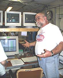 Jim Charters, R/V Melville’s shipboard computer technician, explains the ship’s different types of echo sounders and the types of bathymetric data they collect.