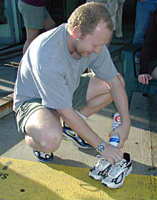 Martial Taillefert fills Brian Glazer’s shoes with whipped cream. It is part of Brian’s initiation for his first Alvin dive. 