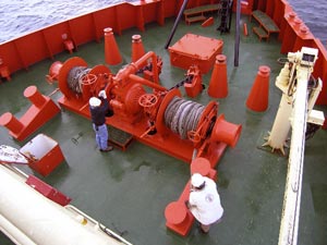 Crew members tend winches loaded with wire on the colorful bow of the Gould (Photo L. VonHarbou) 