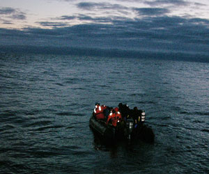 Divers in the Zodiac head out from the ship for a night dive. (Photo by Larry Madin, Woods Hole Oceanographic Institution)