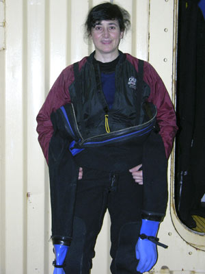 Looking like she has four arms, she has the drysuit halfway up. 