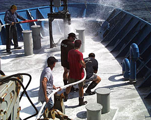  The crew of R/V Atlantis practicing using the fire hoses during today's fire drill. Drills on board ship are important so that when there is a real emergency everyone knows what to do.