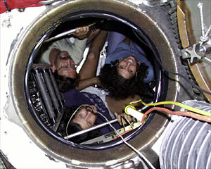  Boy is it crowded in here! Blee gives Paul and Danielle a dive briefing in Alvin’s sphere.