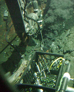 Alvin's manipulator is holding the high-temperature probe to measure how hot the fluid exiting the vent is. The temperature of this vent, P Vent, is 376 ° Celsius.