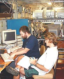 Andy Maffei of Woods Hole and Greg Kurras set up the Dive and Discover Web site server in the main lab. 