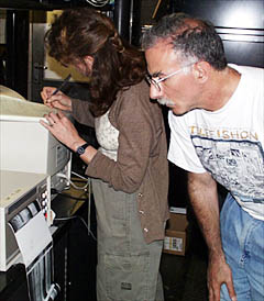 Mike Perfit and Rachel Haymon in the Control Van during the first DSL-120 sonar lowering of the expedition. Mike is looking at the printout of the sonar data -- the first glance of what the seafloor below looks like!
