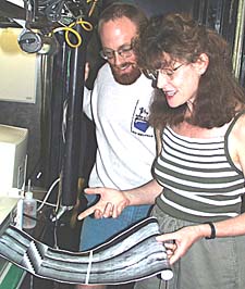 Rachel Haymon and Scott White are all smiles as they watch the seafloor structure unfold on the sonar records in the Control Van.