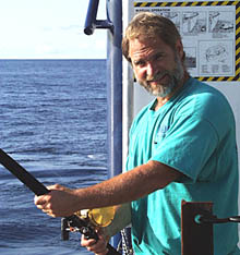 Dave Murline relaxes when he is off-duty by casting his line. He caught several mahi mahi that were schooling on the port side of R/V Melville. The mahi mahi were feeding on smaller flying fish, which in turn eat smaller sea creatures. All animals in the sea are part of “food chains.” Animals lower in the chains become food for animals higher in the chains. At the bottom of the food chain are ocean plants, many of them microscopic in size, that use sunlight to grow. In oceanic ecosystems, nothing is wasted. 
