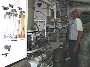 We are surrounded by the water of the Pacific Ocean, but we can’t drink seawater! We have to make all the drinking water we need. Here, Ron Wheatley checks the status of the equipment that makes fresh water -- the evaporator and the reverse osmosis system. 