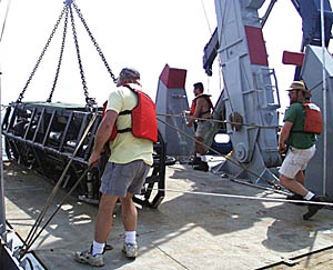 Argo II is brought back on board the ship this afternoon. Ron Comer (center) is directing the operation which requires five people to handle lines and control the winch. A lot of coordination and communication is needed during these types of operations at sea so that equipment is launched and recovered safely and efficiently. Ron is an expert at this having worked as a marine technician at Scripps for over 23 years.
