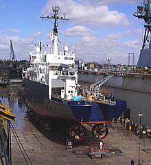 A view of R/V Melville’s port quarter when she was in drydock. Note the port and starboard thrusters mounted side by side. These are the main way in which the ship is propelled. The stern boards and stern A-frame have been removed to expose the stern ramp for cleaning and painting. The stern ramp is similar to ramps found on trawlers, and could be used for hauling nets in fisheries research. On R/V Melville, it is not used very often, so most of the time it is boarded over to provide additional deck space. 