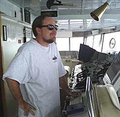 Rob Widdrington, the Second Mate, keeping a look out on the Bridge of R/V Melville.