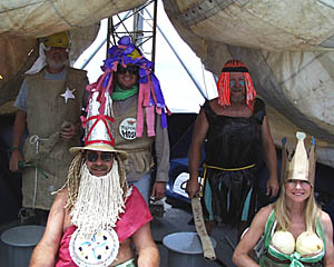 A close-up of part of the Royal Court on board R/V Melville. Seated: King Neptune and his Queen. Standing from left to right: the Sheriff, the Royal Hoser, and the Sea Hag.
