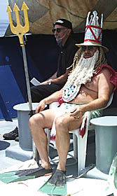 King Neptune (Bob “Yogi” Elder) and The Royal Prosecutor (Mike Perfit) wait for the entertainment provided by the Pollywogs.