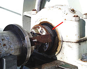 A close up view of the “slip-rings” on the traction winch. The arrow points to the rotating sleeve. Inside this sleeve, the signals are relayed from the end of the fiber optic cable on the rotating drum to the fixed transmission line that brings all the data into the Control Van on the ship. A similar device is used on Ferris Wheels or Merry-Go-Rounds at County Fairs to keep all the lights illuminated as the rides spin around.