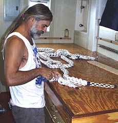 Dave Grimes working on “pointing” a rope. You can see the checkerboard pattern of splicing and knots on the end of the rope lying on the table. This is the “pointing”, and it is beautifully done. This line will be used for the “pilot ladder” -- the rope ladder that the harbor pilot climbs up to get on board R/V Melville when we enter port.