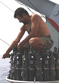 Rob Palomares, the Scripps CTD Technician, washes down the CTD unit in preparation for storage. Maintaining oceanographic equipment is an important job that is critical to keeping equipment operating reliably and producing good data. The seagoing technicians take this job very seriously.
