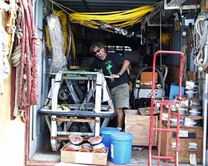 PJ Bernard of the WHOI Deep Submergence Operations Group is all smiles as he ties Argo II down in the shipping van. The rest of the van will be packed with boxes of equipment and shipped back to Woods Hole Oceanographic Institution (WHOI). 