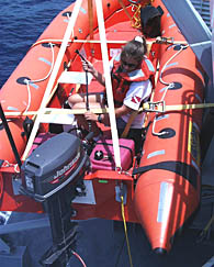 Anja runs the rescue boat each week to be sure that it is  all set to go in an emergency.  She checks that the engine is running and in good shape,  and that all the emergency equipment is stowed on board.