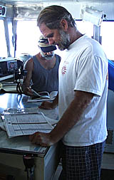 Dave Murline on the Bridge of R/V Melville with his fishing partner Dave Grimes (background) who is the AB (Able-Bodied Seaman) on Dave’s watch. 
