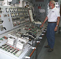 Ron at the Engine Control Center (ECC)—the place where all the dials and controls for the Engine Room are located. These allow the engineers to check and control all the different equipment on the ship from this one location.