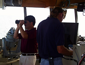 After a three day steam, Knorr’s Captain AD Colburn (with binoculars) and Chief Mate Kent Sheasley direct the ship into Port Louis, on the west side of the island of Mauritius (rhymes with ‘delicious’). The scientists and crew will spend three days on the island - but not at the beaches and lagoons. They will be unloading supplies and setting up labs for their hydrothermal vent research. 