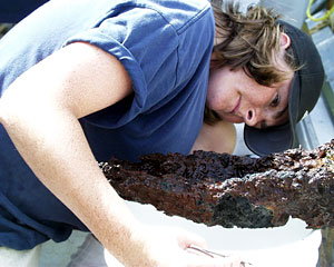 Biologist Shana Goffredi snoops for snails on part of a dead chimney.  