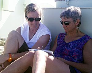  Microbiologists Dorothee Gotz (left) and Anna-Louise Reysenbach review research on Knorr’s deck. The deck is also called "steel beach" by people who like to relax in the sun.  
