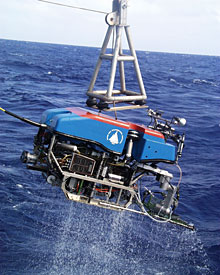 ROV Jason returns to the ship to deliver shrimp samples to the biologists. While on Knorr, the DSOG techs made repairs to Jason’s manipulator arm so that it can trigger more water sampling bottles at the vents during the next dive. They had the ROV back in the ocean early this afternoon.  