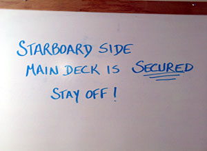 The message board in the mess alerts everyone to stay away from the windward deck of Knorr. 