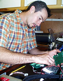  DSOG technician Fran Taylor repairs one of Jason’s circuit boards in the Tool Van.  