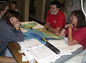 Karen Von Damm (left) confers with Marvin Lilley and Susan Humphris after hearing the good news of finding a hydrothermal plume near 24°S  
