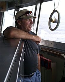  Standing on the bridge is Seaman Jim McGill, who gazes out at a rainy Sunday morning in the Indian Ocean.  
