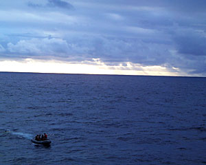 The work boat crew heads back to Knorr after retrieving the elevator just before dark.  