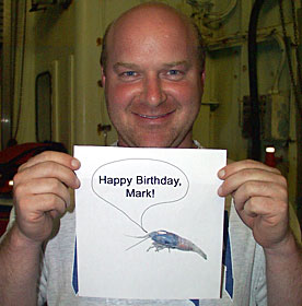 Biologist Tim Shank gets a “little” help from a Rimicaris shrimp to send birthday wishes to his brother Mark in Apex, North Carolina.  