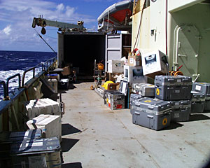 Boxes and crates covered the main deck today before scientists and crew members moved them into the shipping container.  