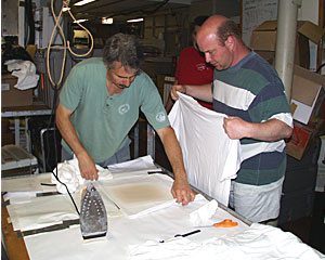Geologist Dan Fornari and Biologist Tim Shank iron the cruise logo onto T-shirts. Everyone on board received a commemorative shirt.  