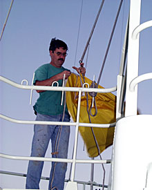 Seaman Bill Dunn hoisted the yellow flag just after dawn this morning. The flag signals that Knorr has not yet cleared immigration and customs in Mauritius. As soon as the ship docks, the immigration and customs officials board and clear the ship. Then the flag is taken down.  