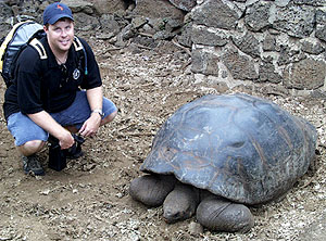  Paul Johnson with a giant Galápagos tortoise at the Darwin Research Station on Santa Cruz. The Galápagos is one of only two places in the world that have giant tortoises, the other being the Seychelles in the Indian Ocean. There were originally 14 subspecies in the Galápagos, but only 11 survive today, mainly because of their destruction by humans. 