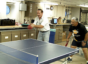 “Big Al” Luallin (left) and Rey Esteban relax with some after-dinner ping pong. Rey is Revelle’s ping-pong master. 