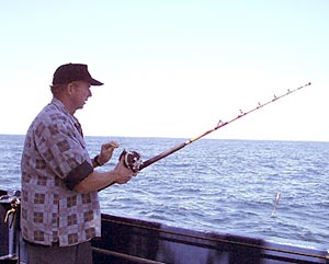  Fishing is a popular pastime on board. Here Jack Healy casts out his line. 