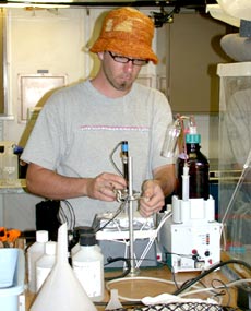 Bill Martin prepares equipment that he will use to analyze the chemistry of hydrothermal fluid samples collected by Alvin. 