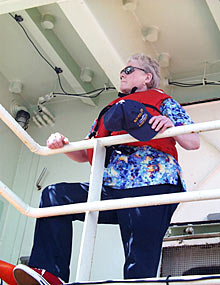 Mess Attendant Linda Bartholomee takes her assigned station during the Fire and Boat Drill.