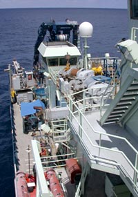 A view of the stern of R/V Atlantis from the Bridge Deck. ABE is sheltered from the sun under the blue shade on the starboard side of the ship.
