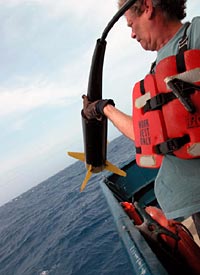 WHOI scientist Rod Catanach, pulling in the magnetometer. 