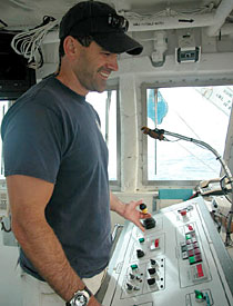 Alvin Pilot Bruce Strickrott, in the "doghouse". The doghouse is the control center for the A-frame that lowers the sub into the water.