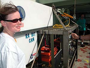 Biologist Rhian Waller in front of the tow-cam before it gets sent overboard. 