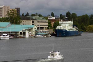 The research vessel Atlantis waits at the dock in Portage Bay at the School of Oceanography on the University of Washington campus in Seattle. 